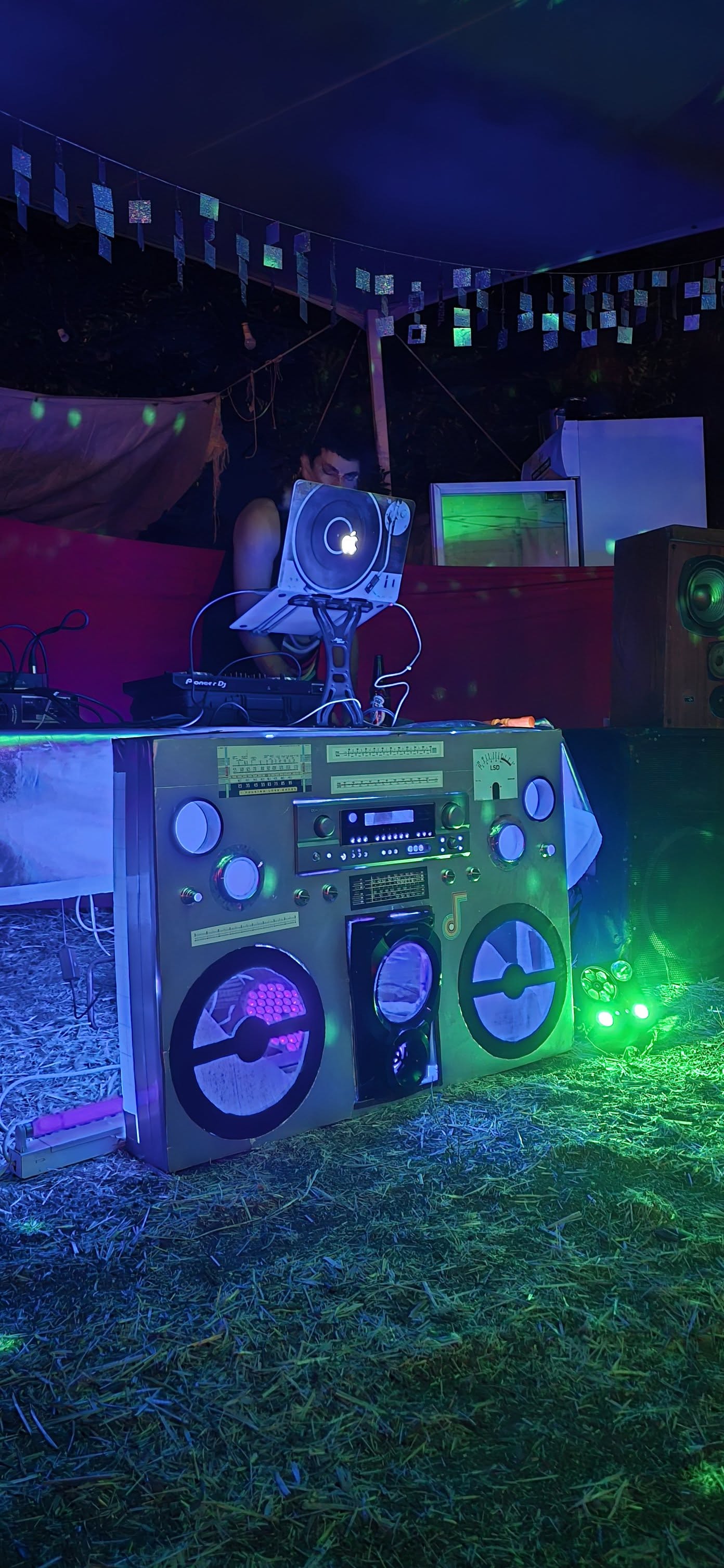 A colourful radio installation glows blue and purple.